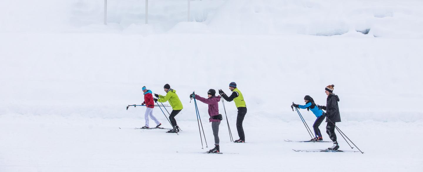 adult cross country skiing camp out in the snow