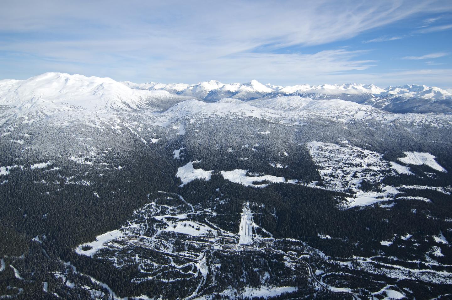 aerial photo of whistler olympic park in the day, covered in snow