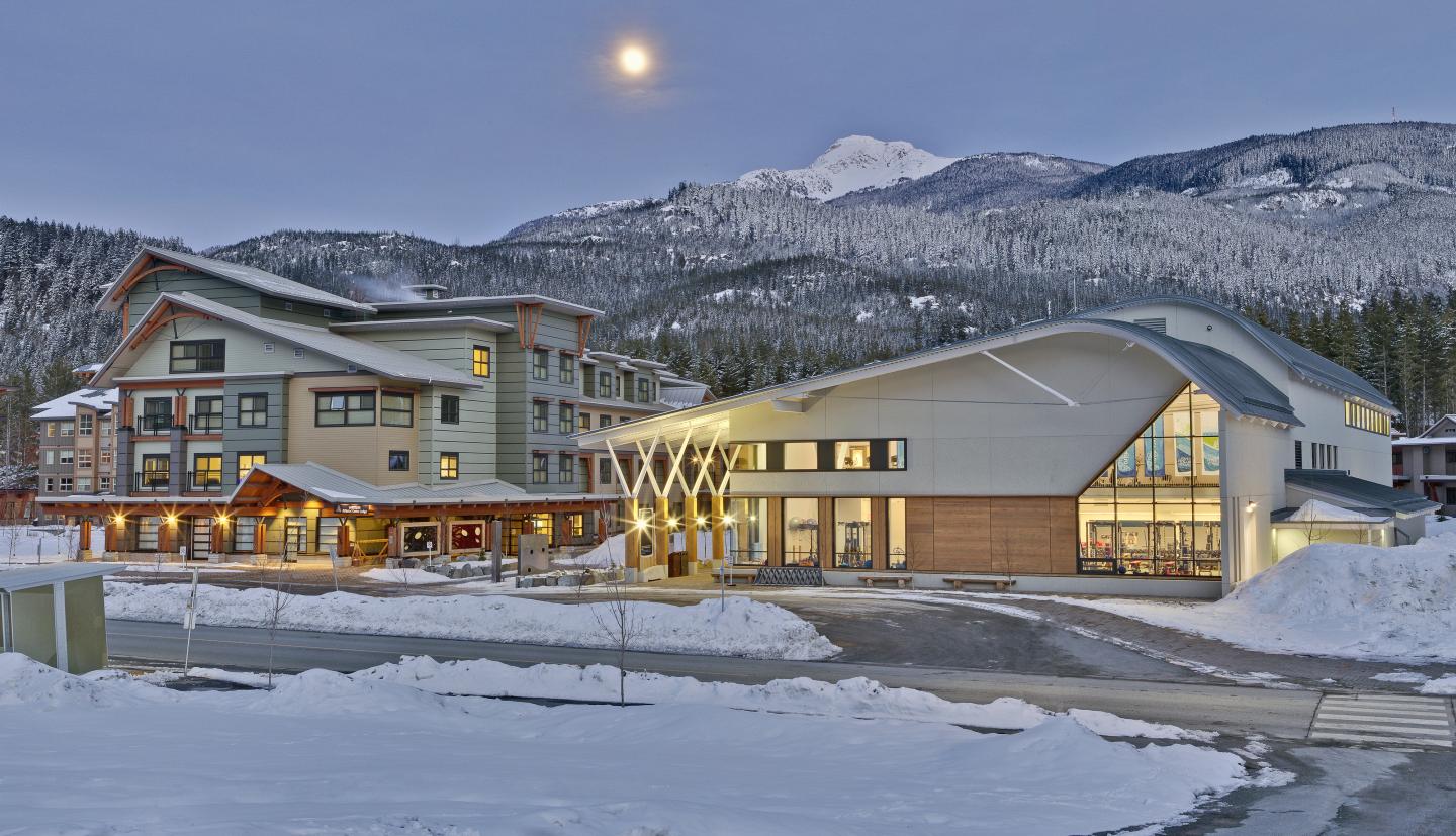 outdoor image of athlete centre as night with mountains in background