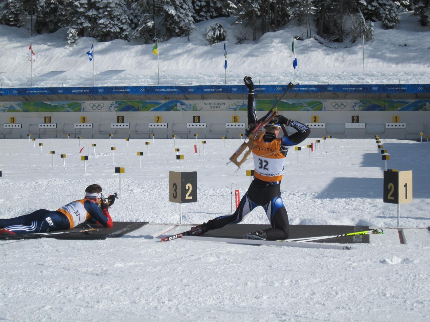two people competing on biathlon range
