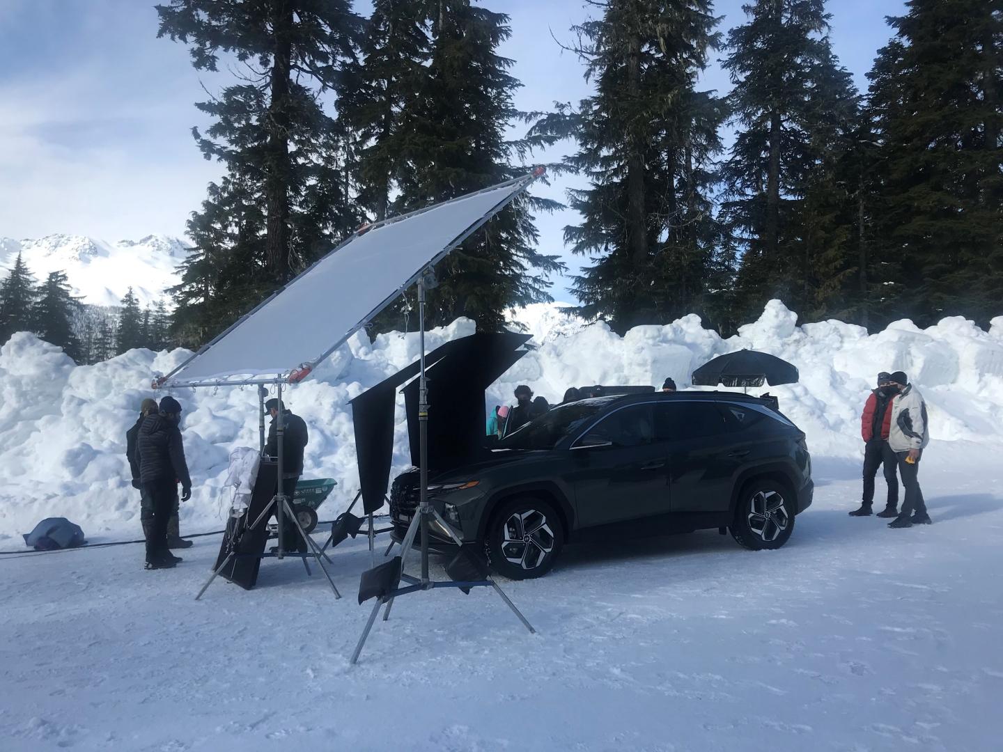 film equipment set up on snowy road in mountains