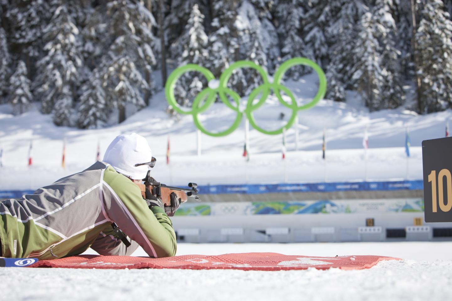 person laying down shooting on the biathlon range