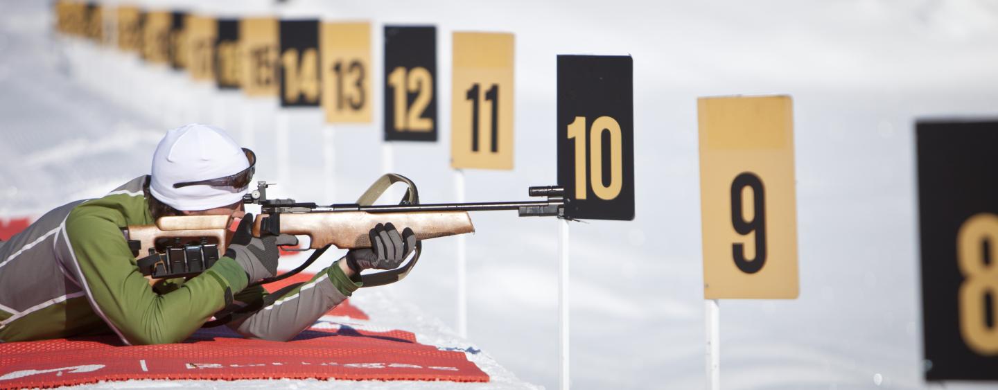 person laying down shooting on the biathlon range