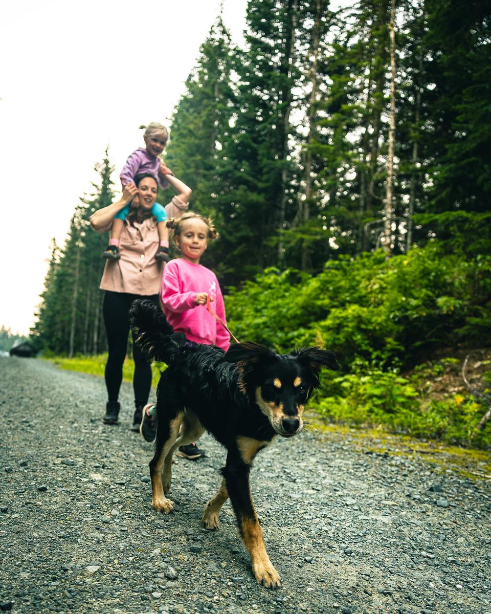 Family walking dog at Whistler Olympic Park