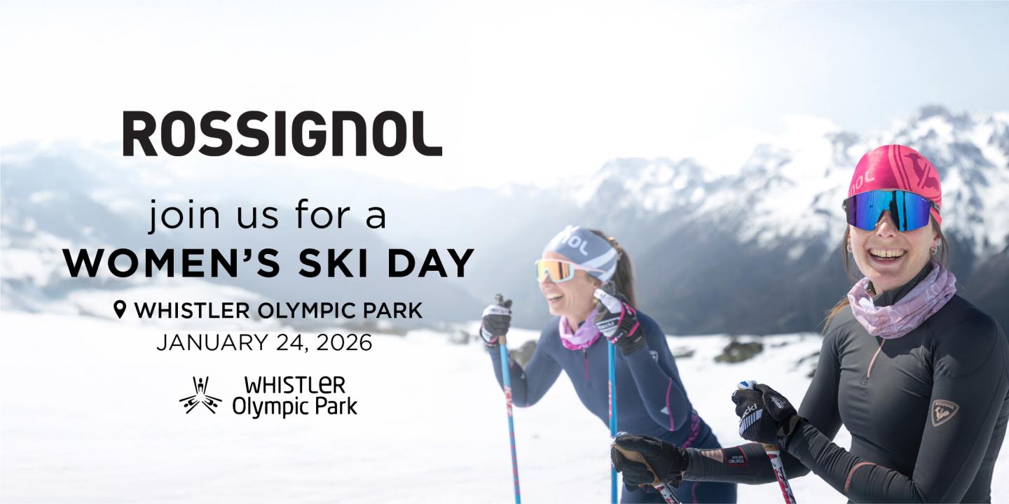 Two women skiing in snowy mountains, smiling, wearing colorful winter gear.